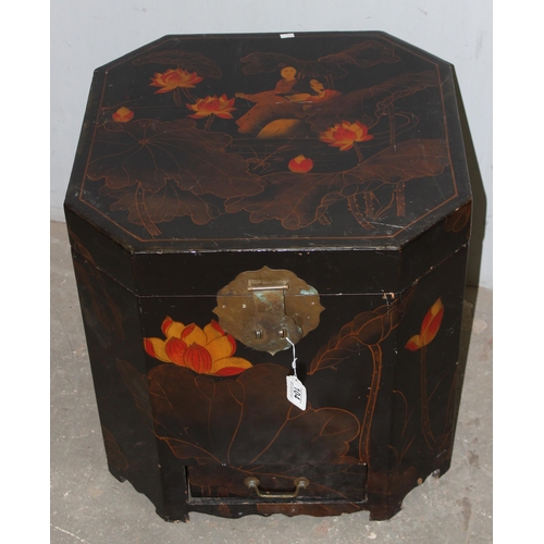 104 - A 20th century Chinese lacquered storage box, with brass handles and locking plate, decorated with w... 