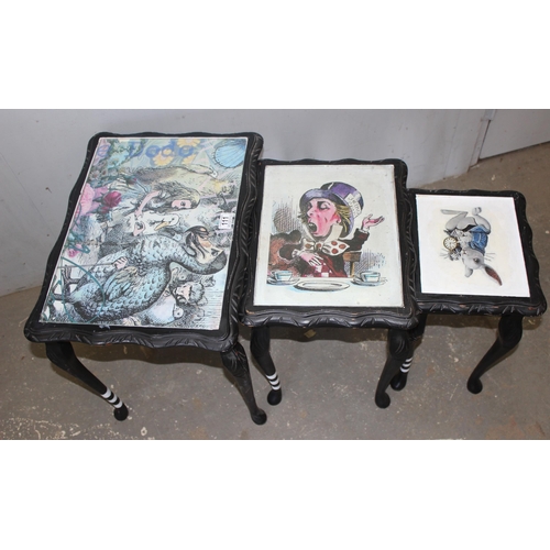 111 - Nest of 3 oriental style side tables all decorated with Alice in Wonderland themed tops, approx 55cm... 