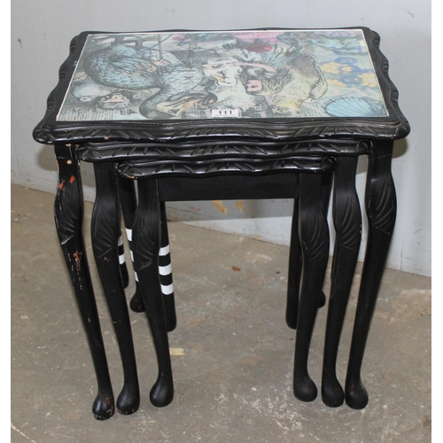 111 - Nest of 3 oriental style side tables all decorated with Alice in Wonderland themed tops, approx 55cm... 