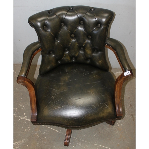 114 - Gainsborough style captain's chair with rich green leather chesterfield upholstery