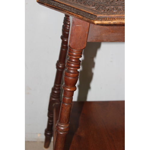 119 - An Arts & crafts period octagonal lamp table with well carved oak top, approx 39cm wide x 39cm deep ... 