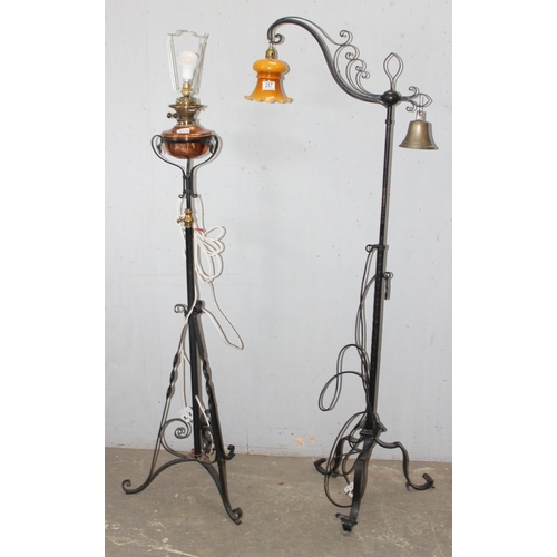 257 - 2 antique style wrought iron standard lamps both in the manner of WAS Benson, one a converted oil la... 