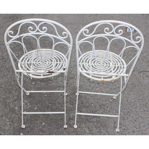 333 - A vintage wrought metal bistro table and 2 chairs, the table approx 60cm wide x 60cm deep x 76cm tal... 