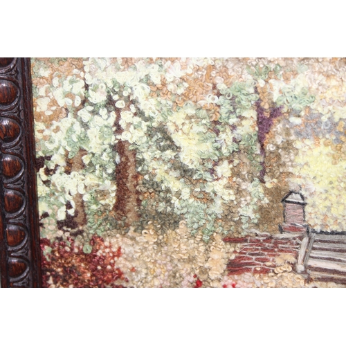 452 - Vintage woven/tapestry type picture of a woodland garden scene in glazed frame, approx 44 x 30cm