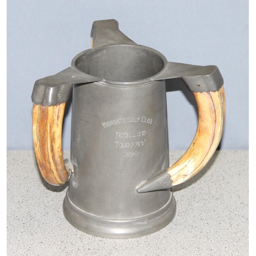 1021 - Pewter tyg cup trophy with 3 boar tusk handles and glass base, by John Taylor & Co London, approx 18... 