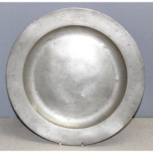 1092 - Antique pewter charger of large form, likely 18th century, approx 42cm wide