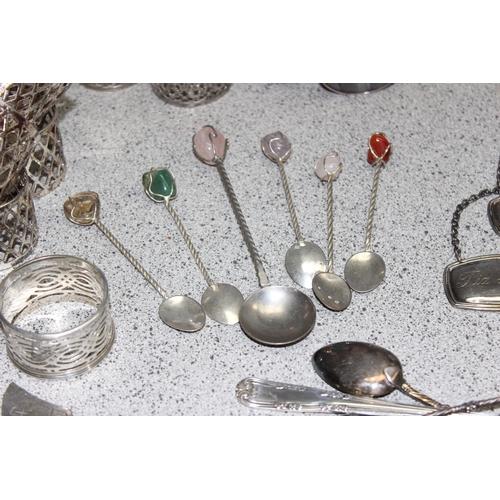 1099A - Mixed lot of interesting silver plated items to include napkin rings, decanter labels and a silver p... 