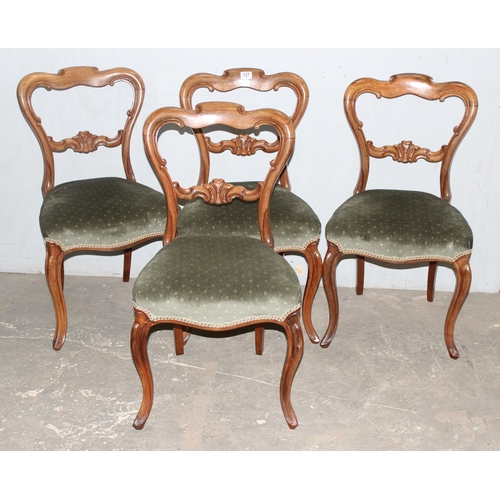 127 - A set of 4 Victorian balloon backed Rosewood dining chairs with carved details and green stuffed sea... 