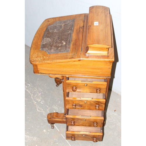 129 - A 19th century walnut Davenport desk with leather inset top and 4 drawers to one side and 4 false dr... 