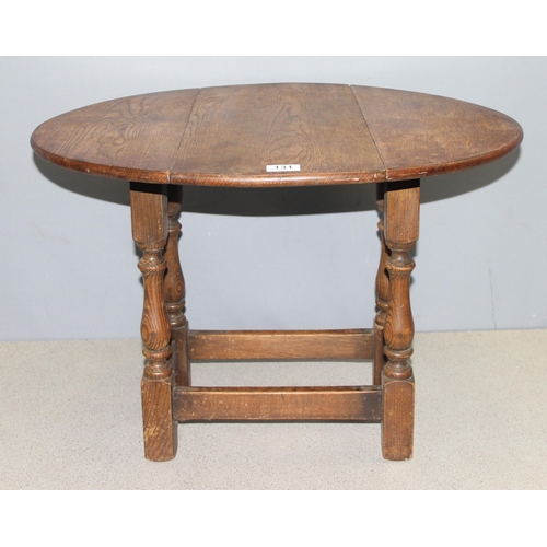 131 - Small vintage oak drop leaf table with swivel top, approx 68cm W x 58cm x 48cm (when open)