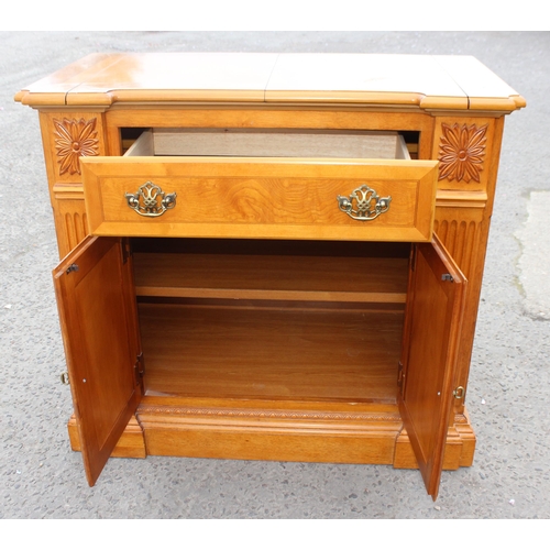 135 - An unusual vintage sideboard with folding serving top and drawer over cupboard base, approx 98cm wid... 