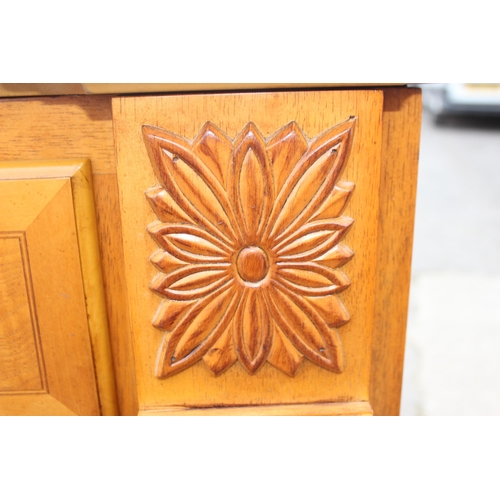 135 - An unusual vintage sideboard with folding serving top and drawer over cupboard base, approx 98cm wid... 