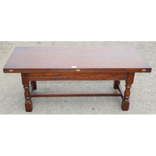 139 - An unusual vintage oak coffee table with fold out top, approx 122cm wide x 51cm deep x 46cm tall (10... 