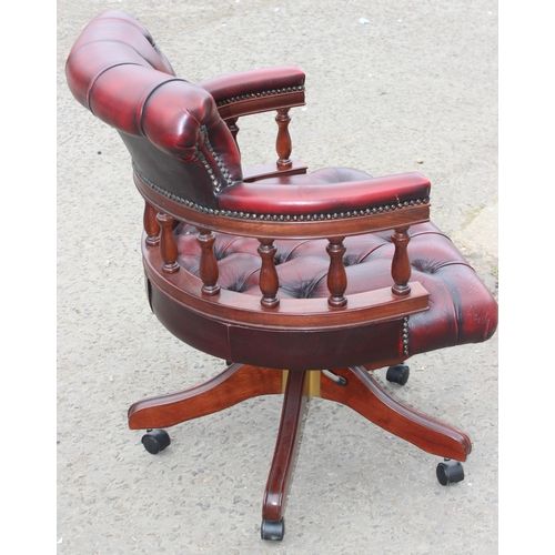 144 - An Ox-Blood red Chesterfield style captain's chair or desk chair