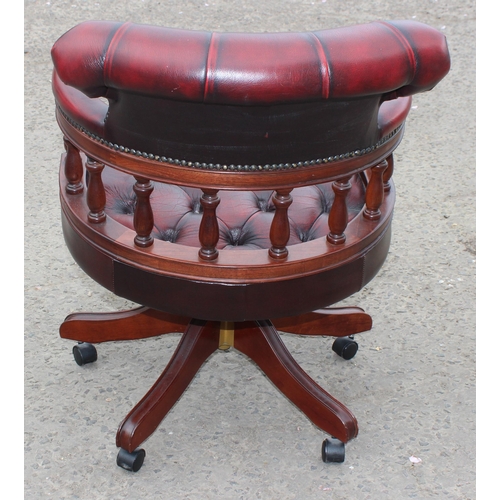 144 - An Ox-Blood red Chesterfield style captain's chair or desk chair