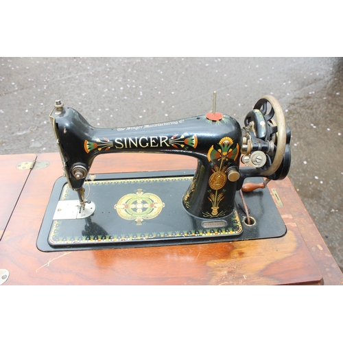 152 - An unusual antique Singer sewing machine cabinet with machine, approx 81cm wide x 45cm deep x 84cm t... 