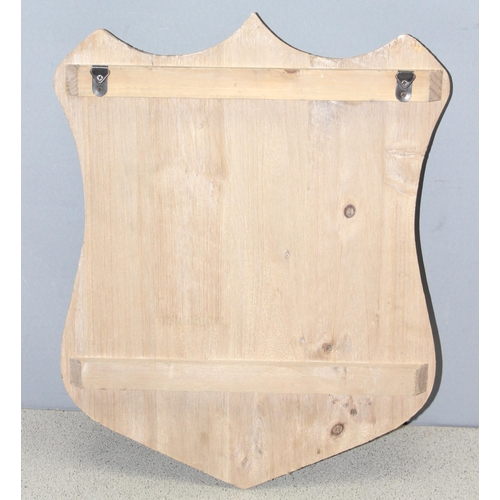 283 - 2 sets of coat hooks on wooden backs, one in the shape of a shield (largest approx 50cm x 4cm)