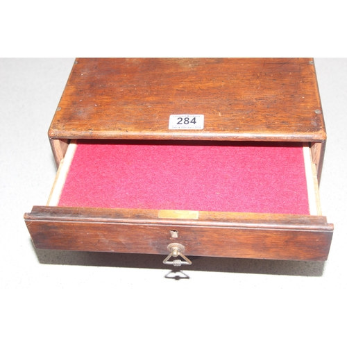 284 - Interesting mahogany table top collectors chest of drawers, the drawer below the top opens all, appr... 