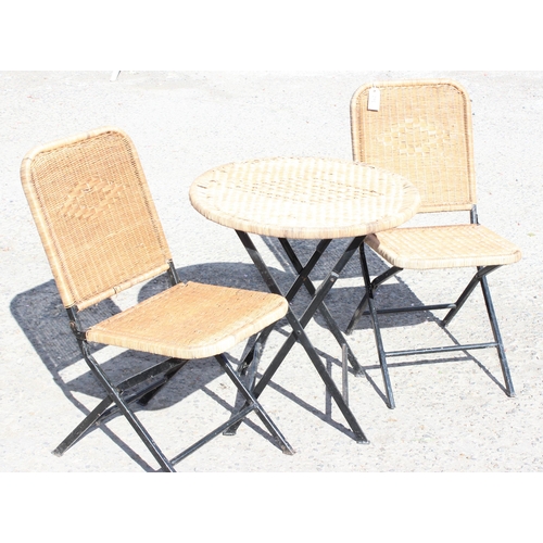 342 - 3-piece folding metal woven rattan topped garden set, round table and two matching chairs