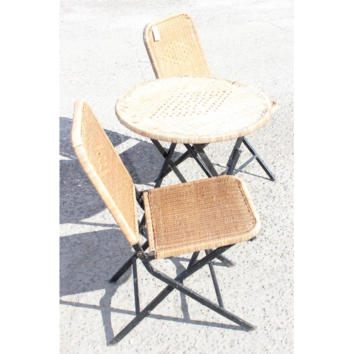 342 - 3-piece folding metal woven rattan topped garden set, round table and two matching chairs