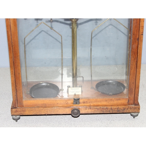 663 - Vintage set of laboratory balance weighing scales in glazed wooden case by W&J George & Becker Ltd, ... 