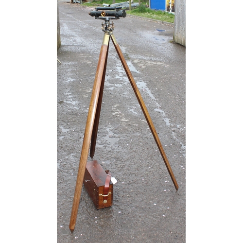 666 - A vintage brass theodolite on wooden tripod stand, by J. Halden & Co of Manchester, with fitted wood... 