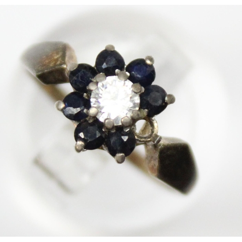 1126 - A retro silver sapphire and white stone floral cluster ring, marked for Birmingham 1959, approx size... 