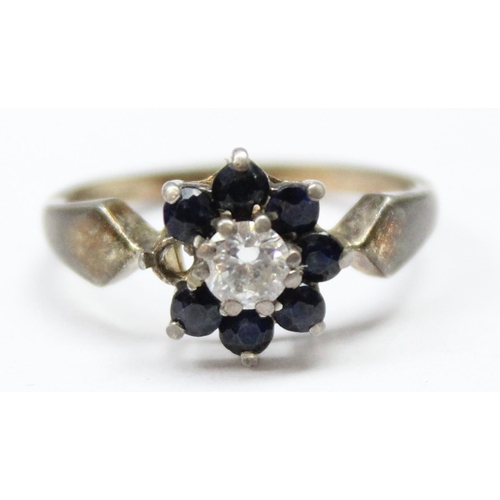 1126 - A retro silver sapphire and white stone floral cluster ring, marked for Birmingham 1959, approx size... 