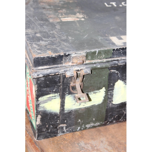 1413 - Two black painted metal military trunks, largest approx 91cm wide x 54cm deep x 41cm tall