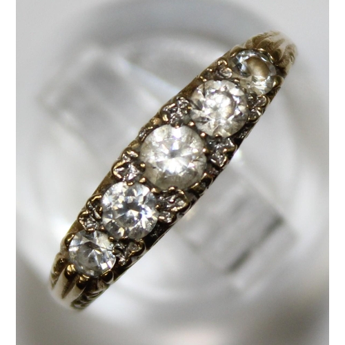 1181 - 9ct gold and white stone ring in scrollwork setting, marked for London 1983, approx Size O & approx ... 