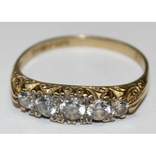 1181 - 9ct gold and white stone ring in scrollwork setting, marked for London 1983, approx Size O & approx ... 