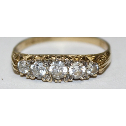 1181 - 9ct gold and white stone ring in scrollwork setting, marked for London 1983, approx Size O & approx ... 