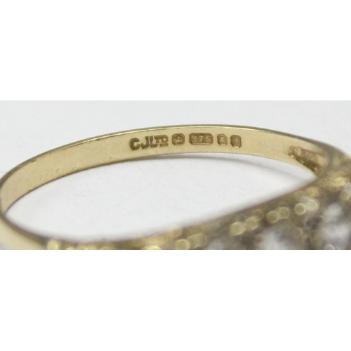 1181 - 9ct gold and white stone ring in scrollwork setting, marked for London 1983, approx Size O & approx ... 