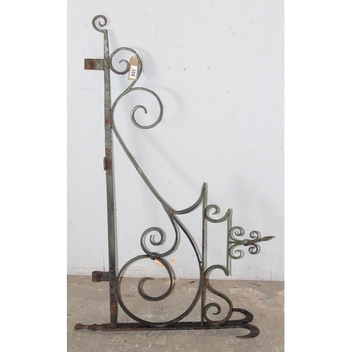 359 - A large vintage wrought iron hanging pub sign bracket, approx 102cm wide x 63cm tall