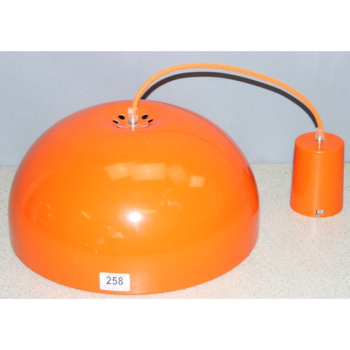 258 - A retro style bright orange metal pendant ceiling light shade with colour coordinated flex, approx 3... 