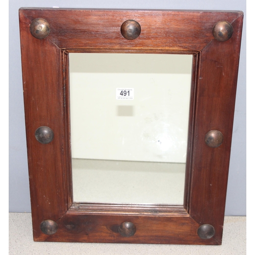 491 - Arts and Crafts style dark stained wooden mirror with large copper studs to surround, approx 56cm x ... 