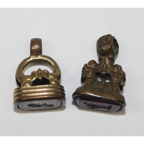 1188 - 2 antique gold plated intaglio fob seals, likely early 19th century and a mother of pearl and silver... 