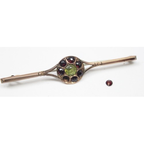 1179 - An antique 9ct gold Peridot and Garnet bar brooch, marked 9ct and XRF confirmed, approx 65mm wide, a... 