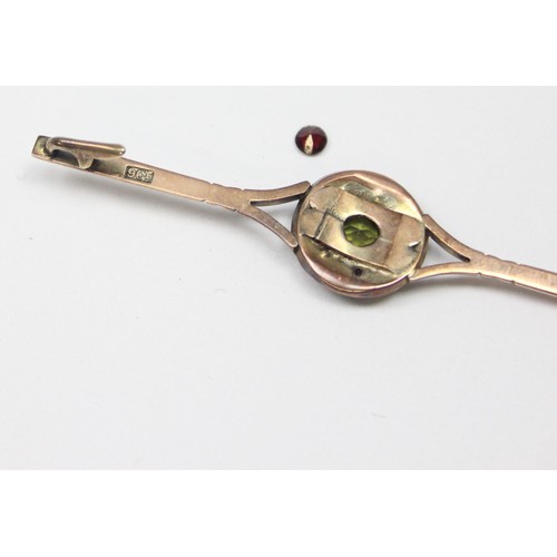 1179 - An antique 9ct gold Peridot and Garnet bar brooch, marked 9ct and XRF confirmed, approx 65mm wide, a... 