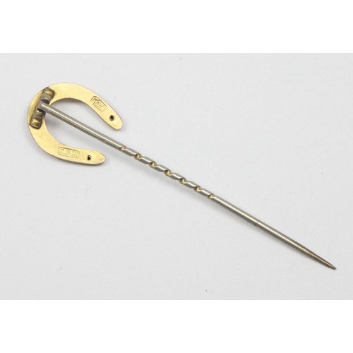 1180 - An antique 9ct gold stick pin formed as a lucky horseshoe, marked 9ct and XRF confirmed, approx 0.84... 