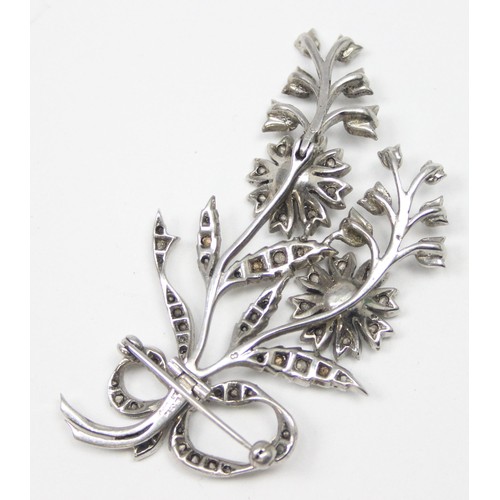 1183 - A vintage SCP made silver and white stone floral En Tremblant brooch, marked SCP to reverse and XRF ... 