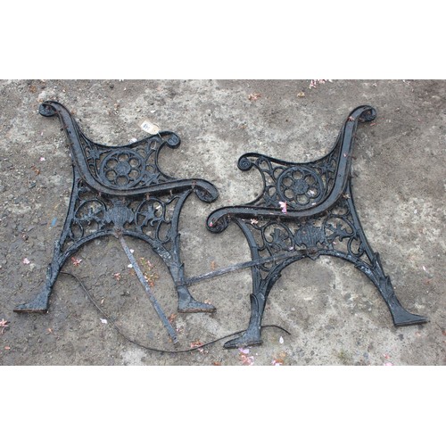 348 - A pair of black painted antique style cast iron bench ends, approx 57cm wide x 71cm tall