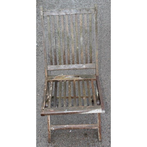 357 - A folding teak garden table and a teak chair, table approx 155cm wide x 90cm deep x 75cm tall