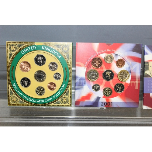 1299R - Great Britain & Northern Ireland Brilliant Uncirculated coinage sets, 9 BU coin sets in folders, dat... 