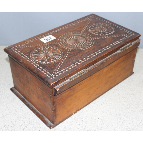 296 - A vintage wooden box with chip carved lid and pine sides, unusual writing to underside, possibly Sca... 