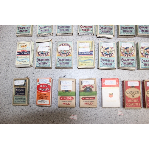 575 - A large qty of assorted cigarette cards, many in vintage Player's Cigarette packaging