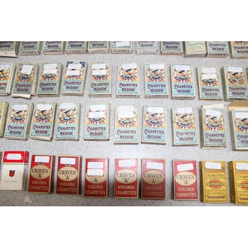 575 - A large qty of assorted cigarette cards, many in vintage Player's Cigarette packaging