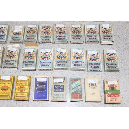 575 - A large qty of assorted cigarette cards, many in vintage Player's Cigarette packaging