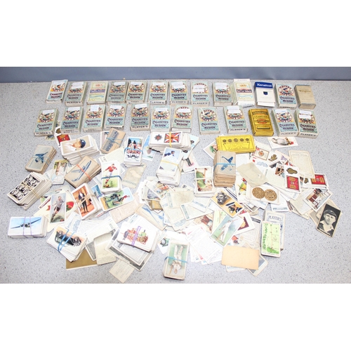 576 - A large qty of assorted cigarette cards, some in vintage Player's Cigarette and other packaging