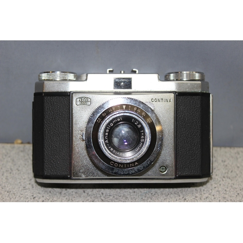 670 - Vintage Zeiss Ikon Contina Prontor -SVS camera in original case, a Zeiss Ikon Ikophot slenium light ... 